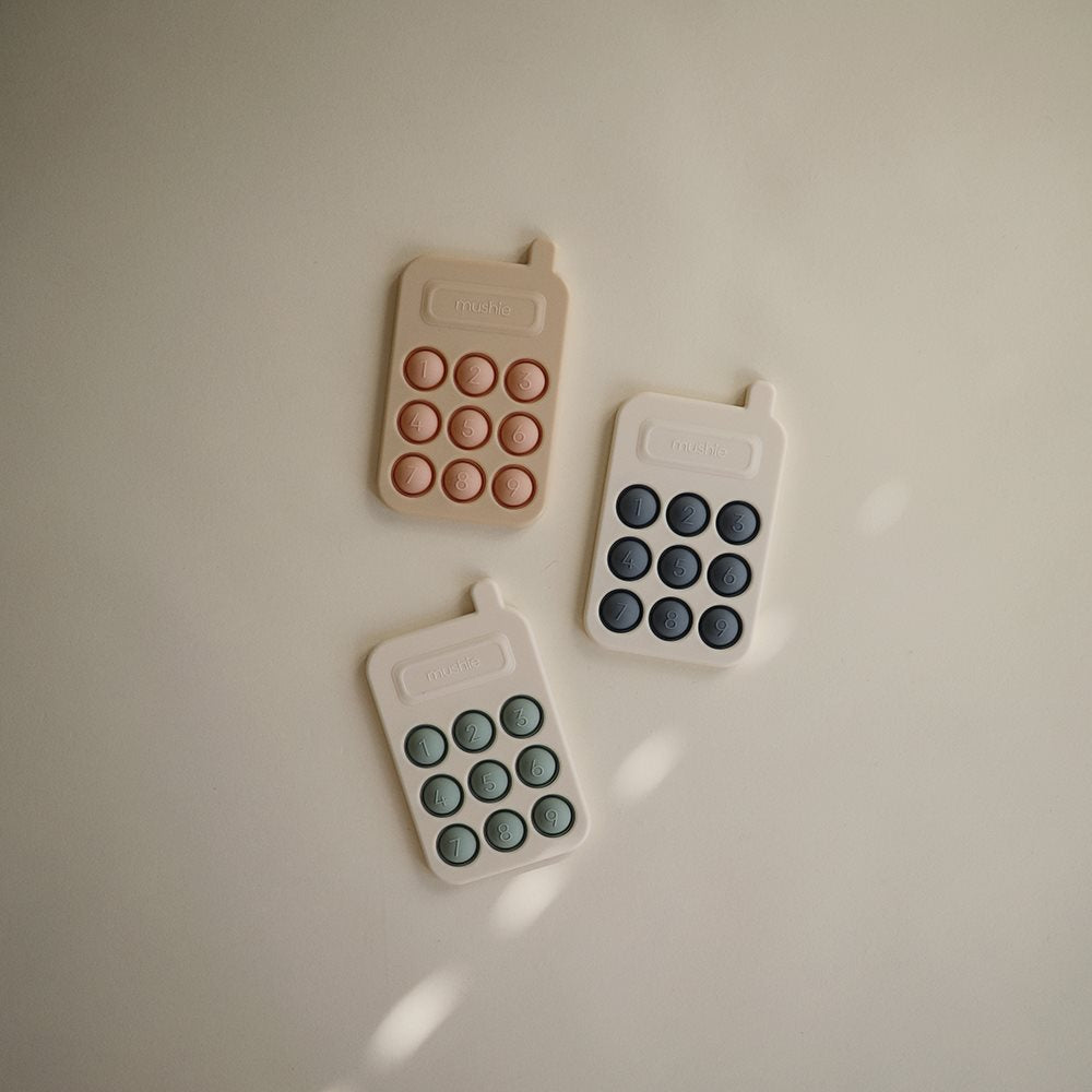 Angelicart - Mushie Phone Press Toy Tradewinds